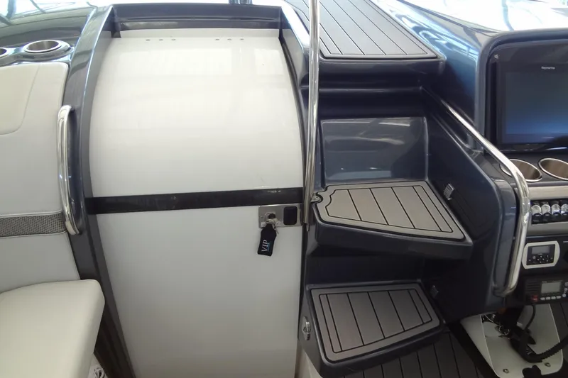 Slide: The Image of 2019 Formula 400 Super Sport boat interior with sleek stairs and control panel. - 29