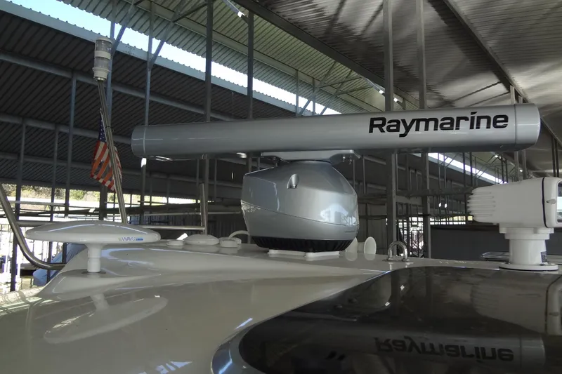 Slide: The Image of 2019 Formula 400 Super Sport boat with Raymarine radar under a covered dock. - 35