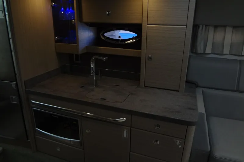 Slide: The Image of 2019 Formula 400 Super Sport yacht interior kitchen with modern cabinetry and appliances. - 38