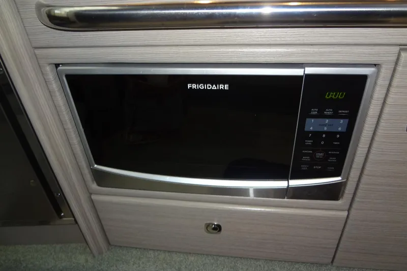 Slide: The Image of Frigidaire microwave in 2019 Formula 400 Super Sport boat interior. - 40