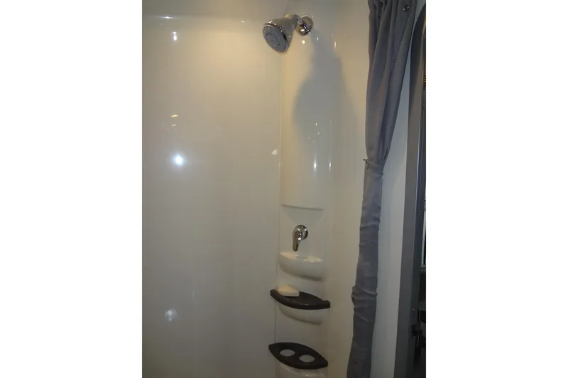 Slide: The Image of Shower area in 2019 Formula 400 Super Sport boat with curtain and shelves. - 49