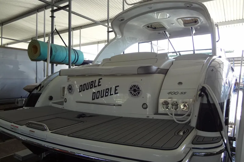 Slide: The Image of 2019 Formula 400 Super Sport yacht in a marina, rear view with "Double Double" name. - 53