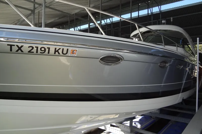 Slide: The Image of 2019 Formula 400 Super Sport boat docked in covered marina. - 6