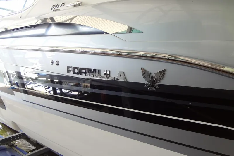 Slide: The Image of 2019 Formula 400 Super Sport boat with sleek design and metallic logo detailing. - 8