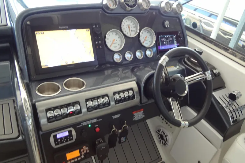 Slide: The Image of 2019 Formula 400 Super Sport boat dashboard with navigation and control instruments. - 9