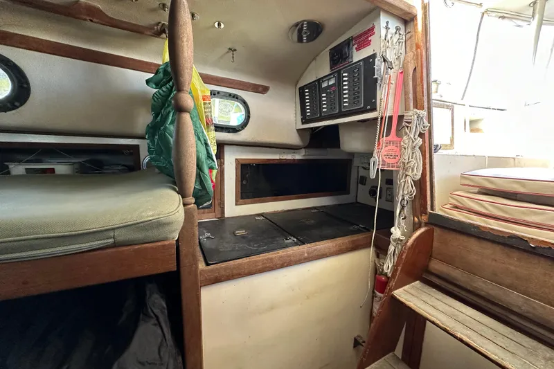 Slide: The Image of 1978 CSY 44 Cutter Rig interior with navigation panel and wooden furnishings. - 31