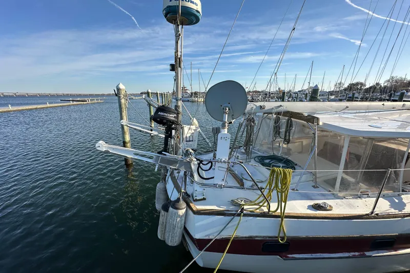Slide: The Image of 1978 CSY 44 Cutter Rig sailboat docked at marina with clear blue sky. - 5