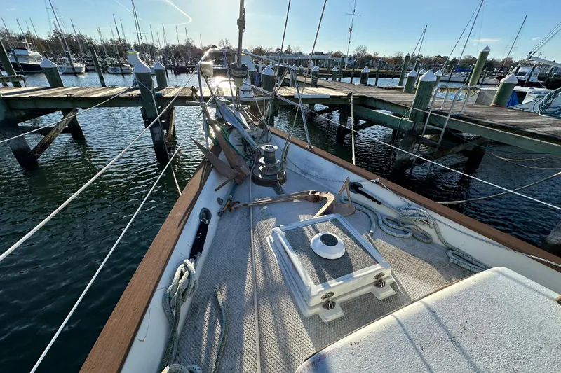 Slide: The Image of 1978 CSY 44 Cutter Rig sailboat docked at a marina, sunny day. - 8