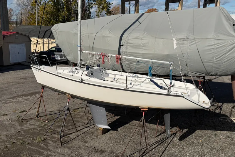 Slide: The Image of Sailboat Colgate 26, 2004 model, on stands in a boatyard. - 3