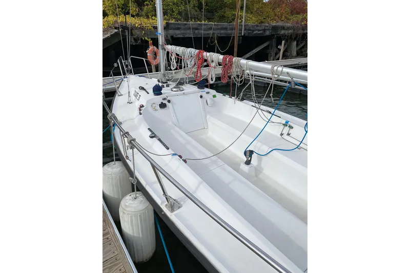 Slide: The Image of Sailboat docked at marina, Colgate 26 model, 2004, with visible rigging and fenders. - 5