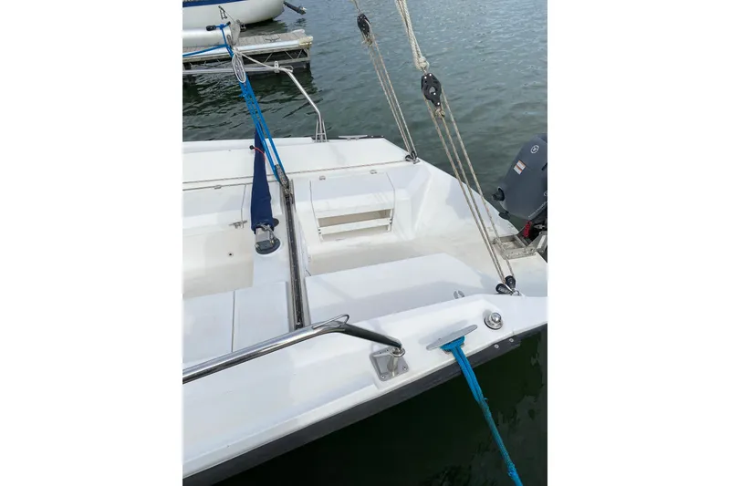 Slide: The Image of Sailboat deck view, Colgate 26, 2004 model, docked with visible ropes and motor. - 7