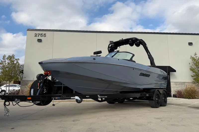 The Image of 2026 MB B52 23 Classic boat on trailer, parked outside a building. - 0