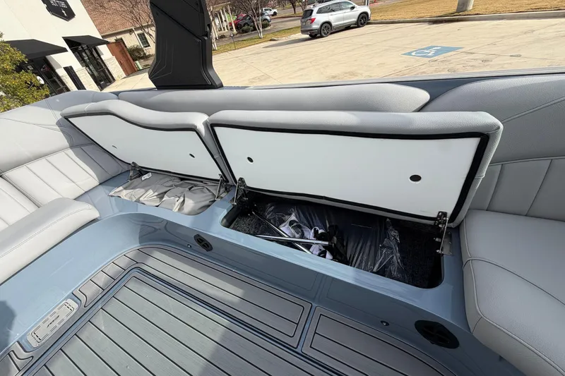 Slide: The Image of 2026 MB B52 23 Classic boat interior with open storage compartments. - 11