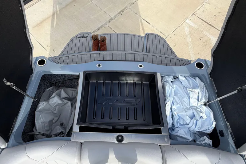 Slide: The Image of 2026 MB B52 23 Classic boat storage compartment with boots and cover. - 12