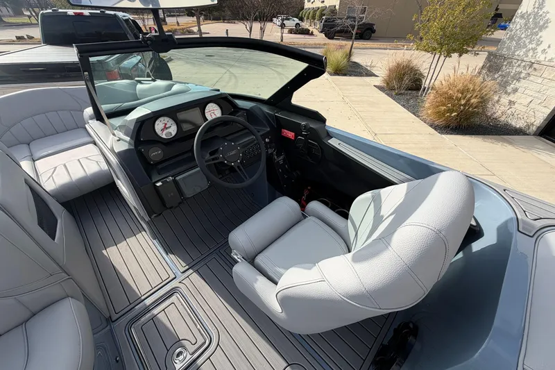 Slide: The Image of 2026 MB B52 23 Classic boat interior with sleek dashboard and comfortable seating. - 7