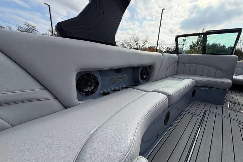 Slide: The Image of 2026 MB B52 23 Classic boat interior with gray seating and built-in speakers. - 9