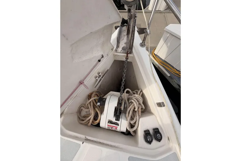 Slide: The Image of Anchor locker of a 2002 Hunter 460 sailboat with ropes and chain. - 14