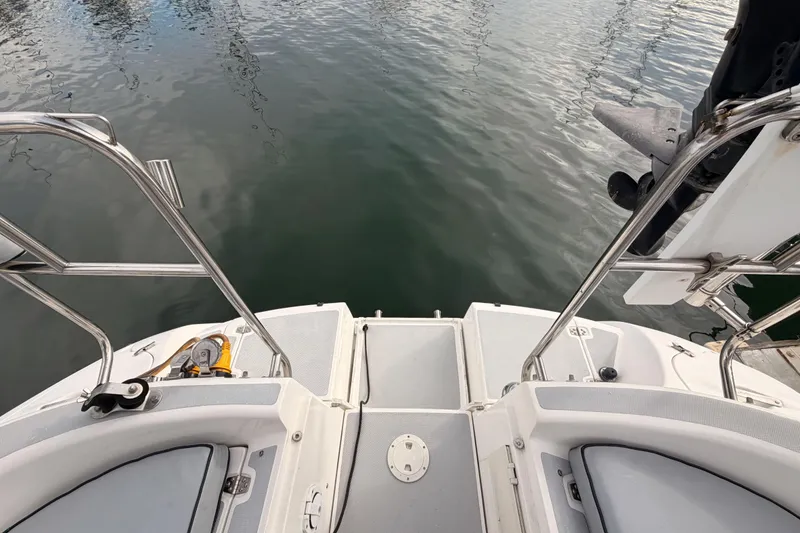 Slide: The Image of Rear view of a 2002 Hunter 460 sailboat with stainless steel railings. - 22