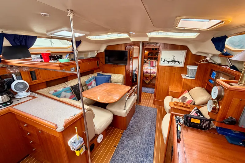 Slide: The Image of Interior of 2002 Hunter 460 yacht with cozy seating and wooden finishes. - 64