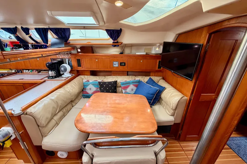 Slide: The Image of Cozy interior of 2002 Hunter 460 yacht with dining area and modern amenities. - 65