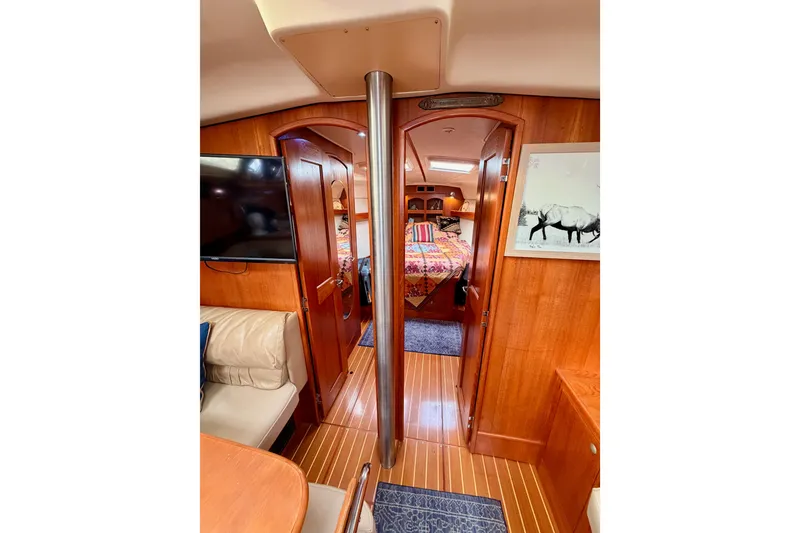 Slide: The Image of Interior of 2002 Hunter 460 yacht with wood finish and cozy cabin. - 69