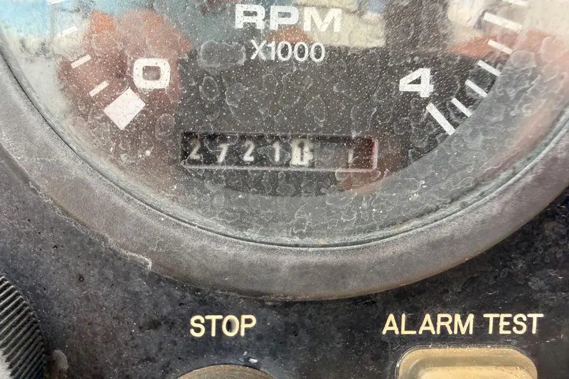 Slide: The Image of Close-up of a dusty RPM gauge on a 2002 Hunter 460 boat. - 86