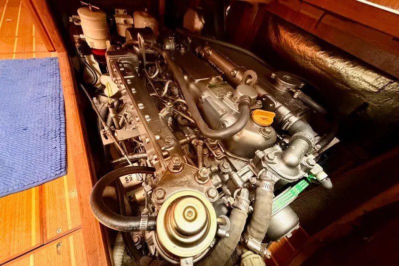 Slide: The Image of Engine compartment of a 2002 Hunter 460 sailboat, showcasing detailed mechanical components. - 88