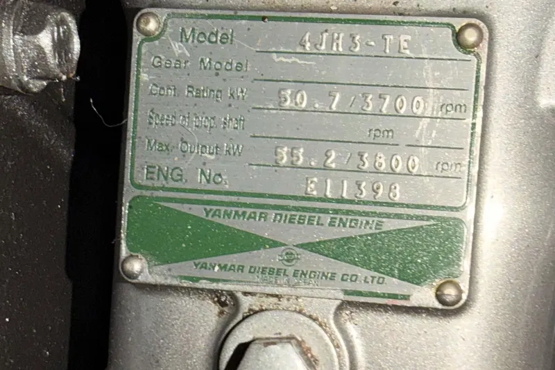Slide: The Image of Yanmar diesel engine plate on 2002 Hunter 460, model 4JH3-TE, showing specifications. - 89