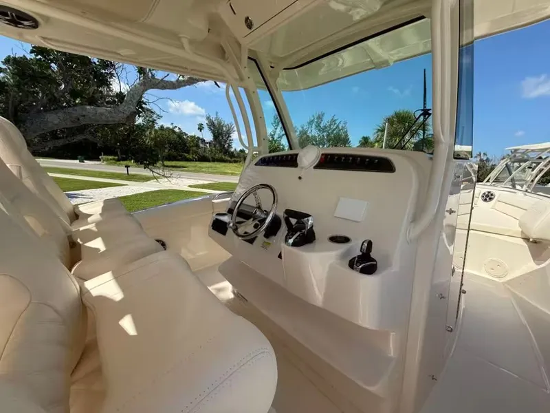 Slide: The Image of Interior view of 2026 Grady-White Canyon 326 boat, featuring helm and seating. - 5