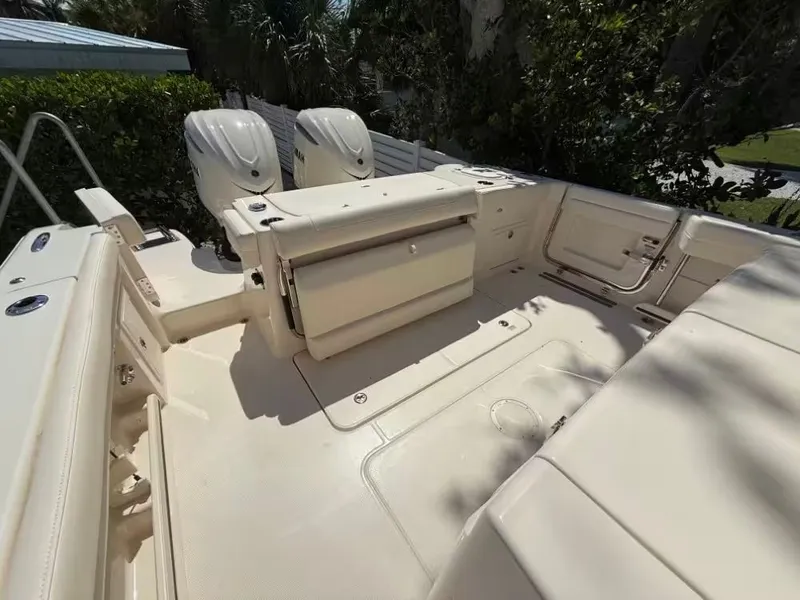 Slide: The Image of 2026 Grady-White Canyon 326 boat interior with dual engines and spacious seating. - 6