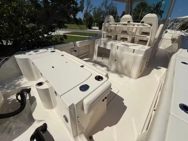 Slide: The Image of 2026 Grady-White Canyon 326 boat interior with seating and storage compartments. - 8