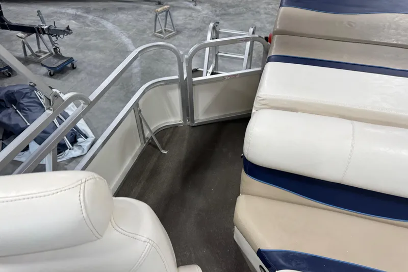 Slide: The Image of Interior of a 2005 G3 boat with white and blue seating. - 14