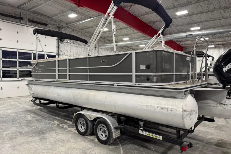 Slide: The Image of 2013 Crest 22 Crest II XRS pontoon boat on trailer in indoor storage facility. - 4