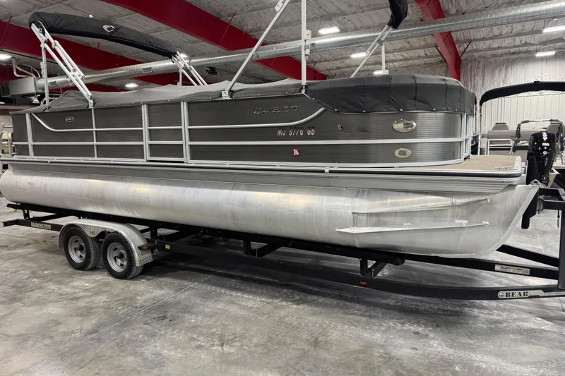 Slide: The Image of 2013 Crest 22 Crest II XRS pontoon boat on trailer in indoor storage. - 5