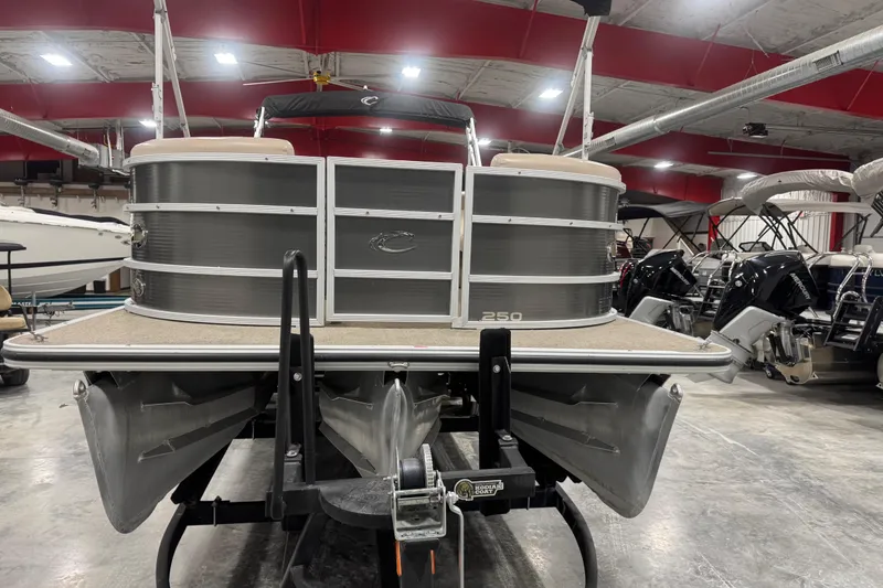 Slide: The Image of 2013 Crest 22 Crest II XRS pontoon boat in indoor storage facility. - 6