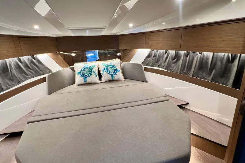 Slide: The Image of Luxurious interior of 2024 Beneteau Antares 11 with cozy bed and stylish decor. - 12