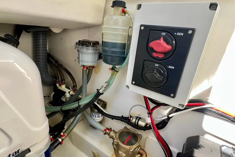 Slide: The Image of Engine compartment of 2024 Beneteau Antares 11 with control panel and wiring. - 26