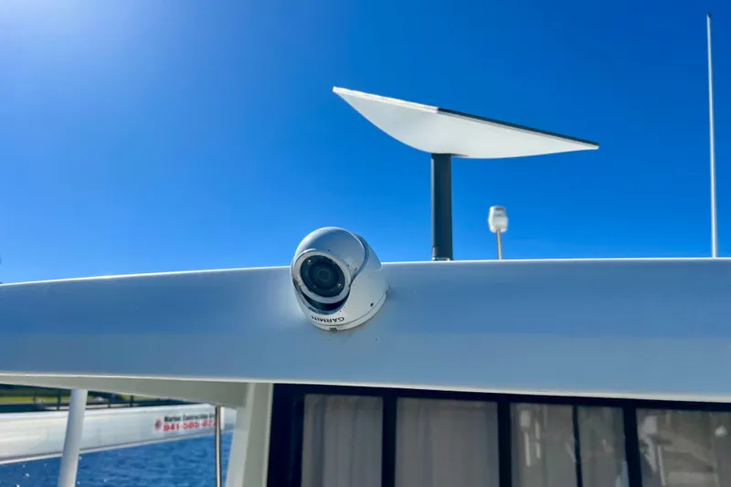 Slide: The Image of 2024 Beneteau Antares 11 with Garmin camera and radar, under clear blue sky. - 31