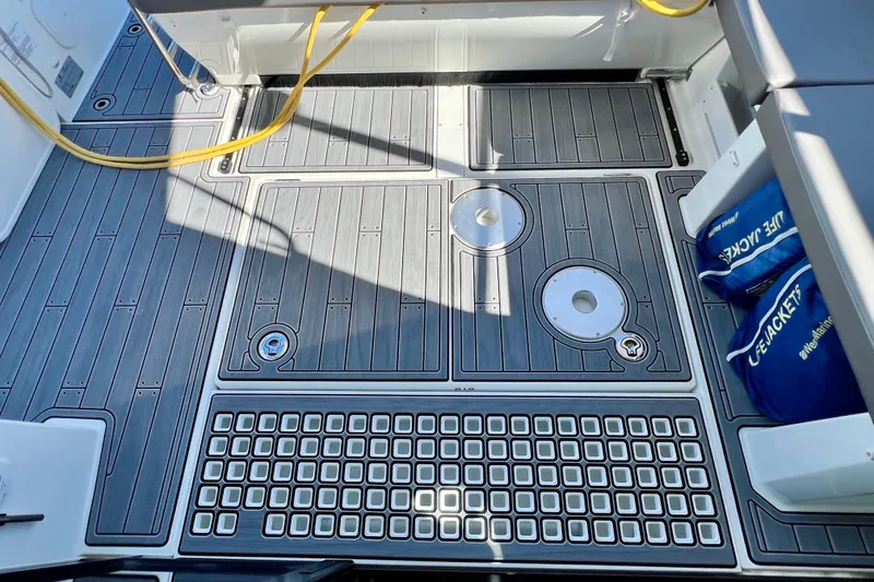 Slide: The Image of 2024 Beneteau Antares 11 deck with modern design and safety equipment. - 6