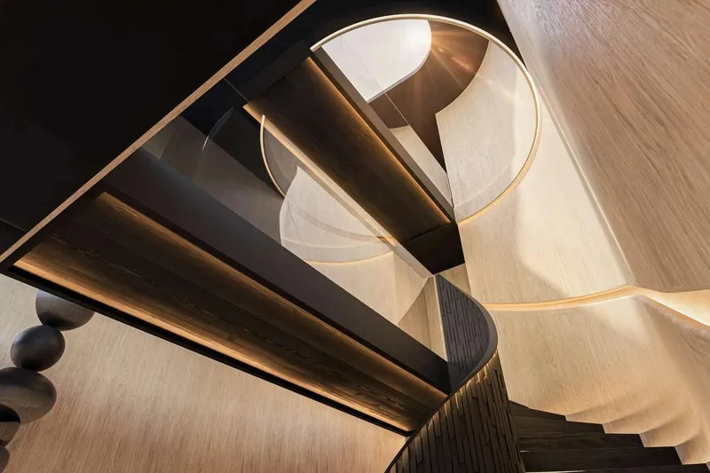 Slide: The Image of Luxurious interior staircase of 2026 Sunreef 65M Explorer yacht, featuring modern design elements. - 16