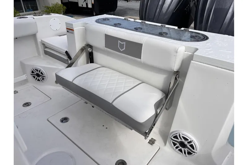 Slide: The Image of 2025 Sea Fox 288 Commander boat with foldable bench seat and speakers. - 19