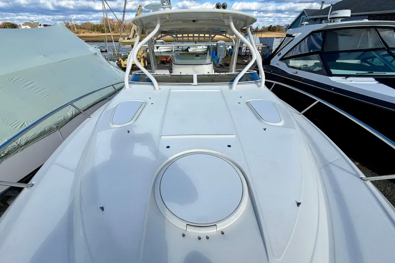Slide: The Image of 2008 Hydra-Sports Vector 3500 VX boat docked, showcasing spacious deck and sleek design. - 10