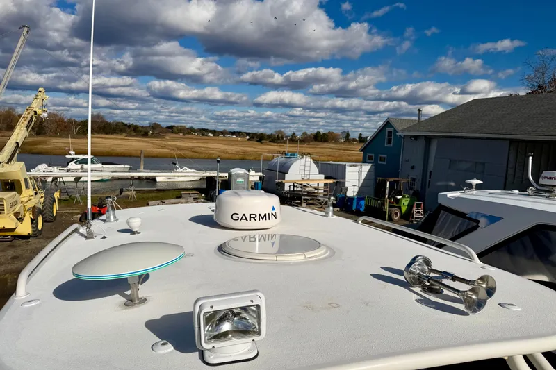 Slide: The Image of 2008 Hydra-Sports Vector 3500 VX boat with Garmin equipment on deck, docked under a cloudy sky. - 14