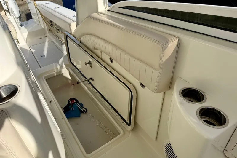Slide: The Image of 2008 Hydra-Sports Vector 3500 VX boat interior with open storage compartment and cup holders. - 30