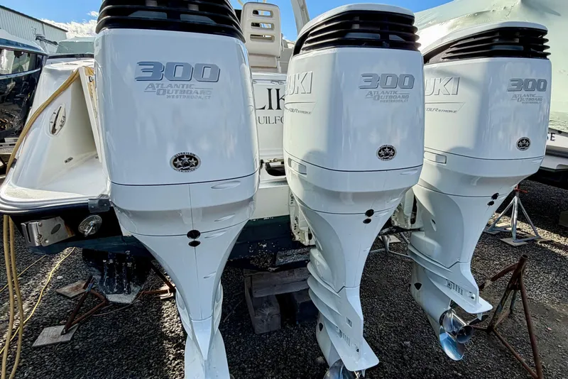 Slide: The Image of 2008 Hydra-Sports Vector 3500 VX with triple Suzuki 300 outboard engines, docked on gravel. - 44