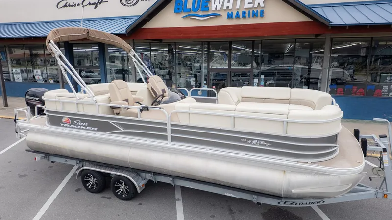 Slide: The Image of 2019 Sun Tracker 24 Party Barge pontoon boat on trailer at Blue Water Marine. - 3