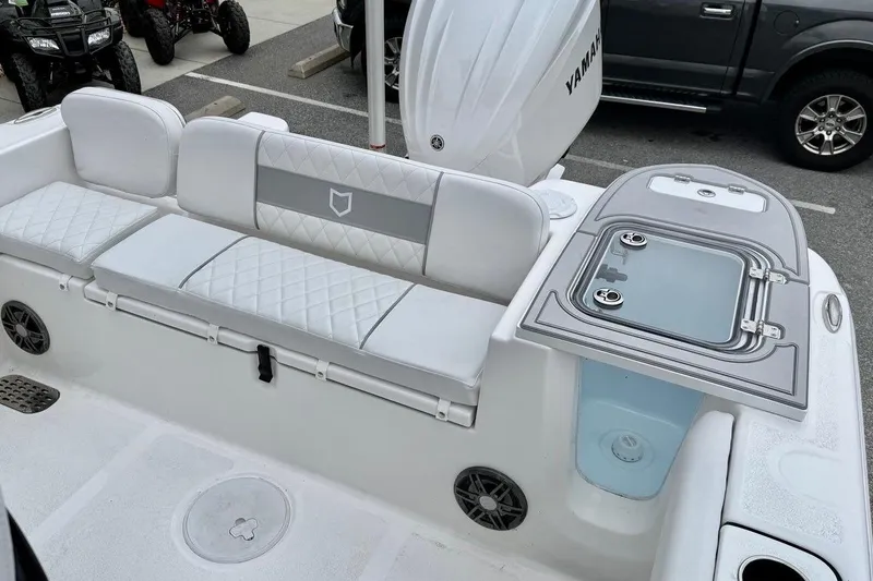 Slide: The Image of 2026 Sea Fox 248 Commander boat interior with cushioned seating and storage compartments. - 7