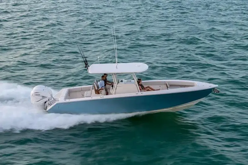 The Image of 2019 Jupiter 34 HFS boat cruising on open water, featuring sleek design and powerful engines. - 0