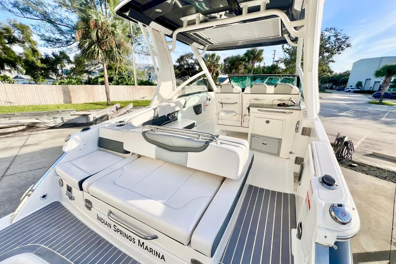 Slide: The Image of 2021 Chaparral 280 OSX boat at Indian Springs Marina, featuring sleek design and powerful engine. - 11