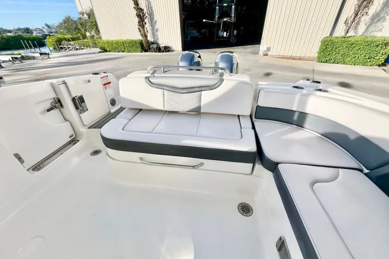 Slide: The Image of 2021 Chaparral 280 OSX boat interior with luxurious seating and modern amenities. - 14